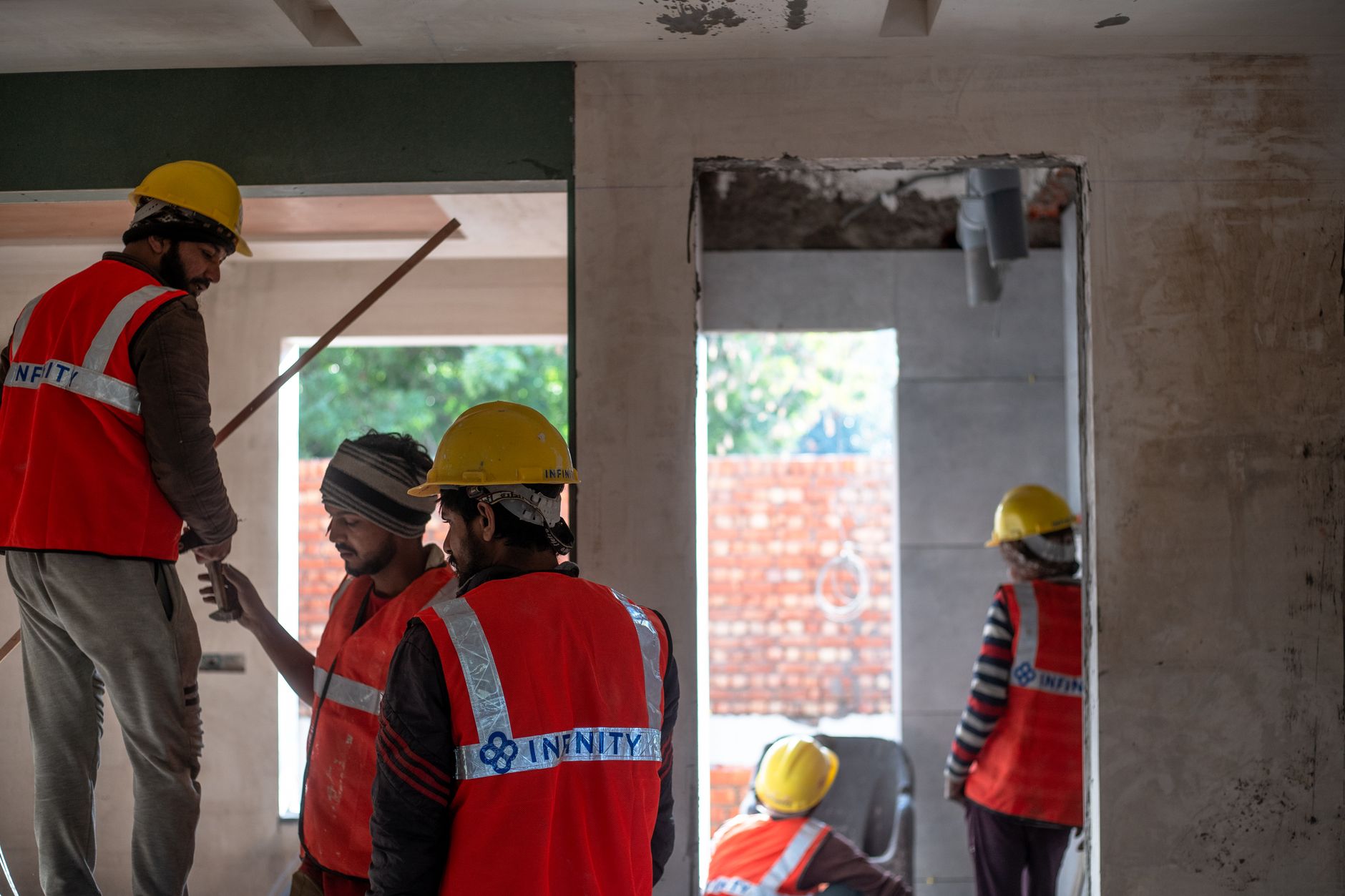 Construction workers on a large building site, representative of Dholera jobs and construction
